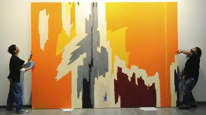 Leaning paintings against the wall.